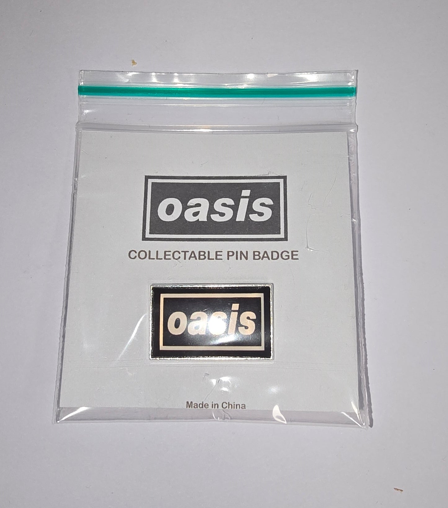 Oasis Pin Badge